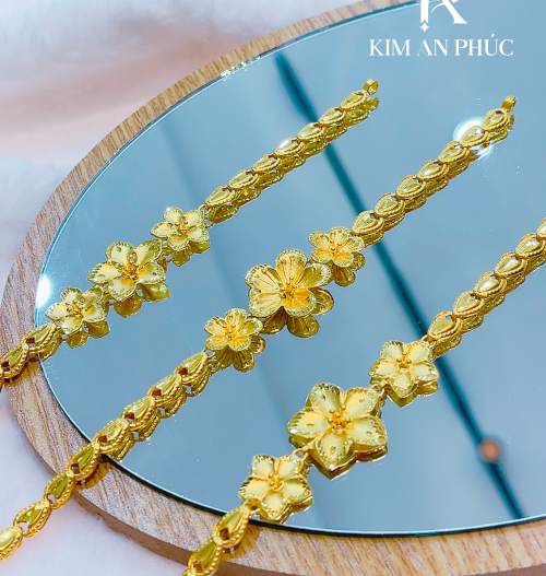 Lắc tay hoa vàng 980