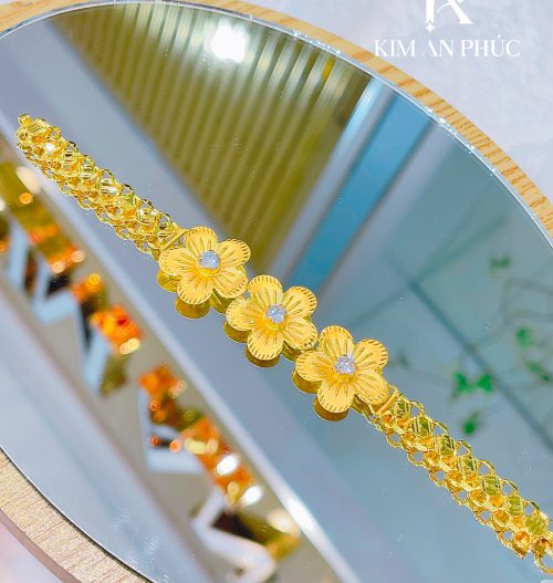 Lắc tay hoa vàng 980