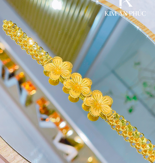 Lắc tay hoa vàng 980